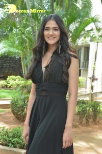Actress Simran Choudhary poses in a Black Dress for a Photoshoot