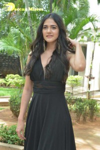Actress Simran Choudhary poses in a Black Dress for a Photoshoot