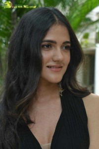 Actress Simran Choudhary poses in a Black Dress for a Photoshoot