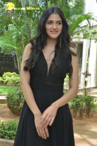 Actress Simran Choudhary poses in a Black Dress for a Photoshoot