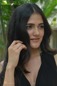 Actress Simran Choudhary poses in a Black Dress for a Photoshoot