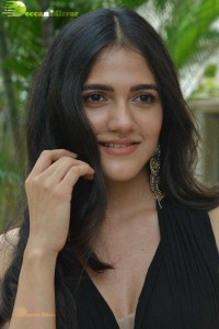 Actress Simran Choudhary poses in a Black Dress for a Photoshoot