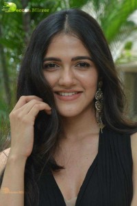 Actress Simran Choudhary poses in a Black Dress for a Photoshoot