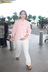 actress Sobhita Dhulipala in a pink shirt and white trousers at mumbai airport