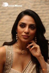 Actress Sobhita Dhulipala in a gold color saree