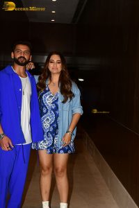actress sonakshi sinha in a short blue dress with her husband