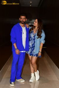 actress sonakshi sinha in a short blue dress with her husband