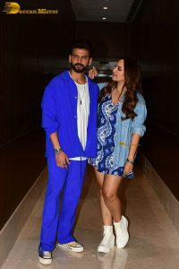 actress sonakshi sinha in a short blue dress with her husband