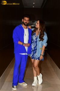 actress sonakshi sinha in a short blue dress with her husband