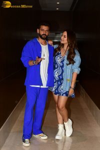 actress sonakshi sinha in a short blue dress with her husband