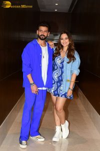 actress sonakshi sinha in a short blue dress with her husband
