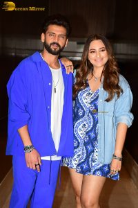 actress sonakshi sinha in a short blue dress with her husband