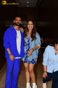 actress sonakshi sinha in a short blue dress with her husband