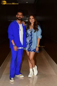 actress sonakshi sinha in a short blue dress with her husband