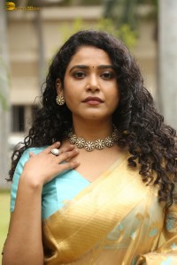 actress Sonakshi Verma in a gold color saree