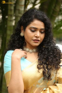 actress Sonakshi Verma in a gold color saree