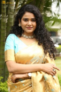 actress Sonakshi Verma in a gold color saree