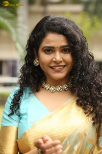 actress Sonakshi Verma in a gold color saree