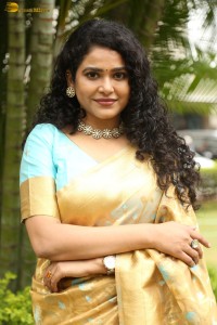 actress Sonakshi Verma in a gold color saree