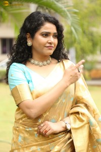 actress Sonakshi Verma in a gold color saree