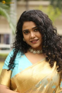 actress Sonakshi Verma in a gold color saree