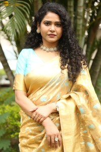 actress Sonakshi Verma in a gold color saree