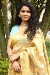 actress Sonakshi Verma in a gold color saree