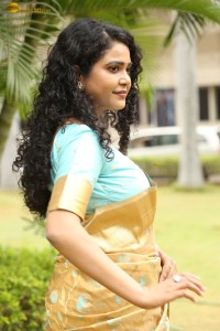 actress Sonakshi Verma in a gold color saree