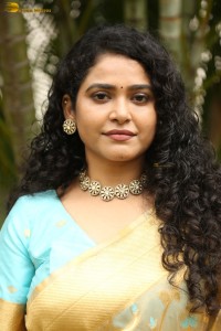 actress Sonakshi Verma in a gold color saree