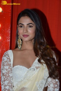 Actress Sonal Chauhan in a light yellow saree