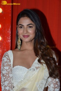 Actress Sonal Chauhan in a light yellow saree