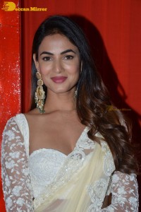 Actress Sonal Chauhan in a light yellow saree