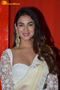 Actress Sonal Chauhan in a light yellow saree