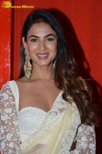 Actress Sonal Chauhan in a light yellow saree