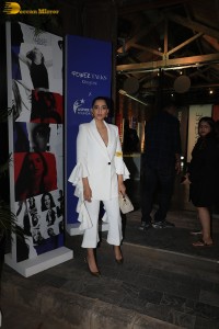 bollywood actress and anil kapoor’s daughter Sonam Kapoor in a white suit at an event
