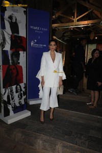 bollywood actress and anil kapoor’s daughter Sonam Kapoor in a white suit at an event