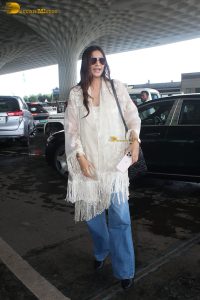actress sonam kapoor gorgeous in a white top and flowing hair at mumbai airport