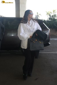 actress sonam kapoor dressed in black and white with loose hair