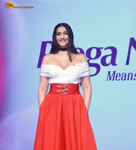 sonam kapoor hot looks in a white shoulderless top and red skirt at an event