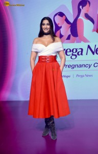 sonam kapoor hot looks in a white shoulderless top and red skirt at an event