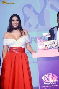 sonam kapoor hot looks in a white shoulderless top and red skirt at an event