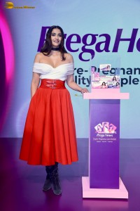 sonam kapoor hot looks in a white shoulderless top and red skirt at an event