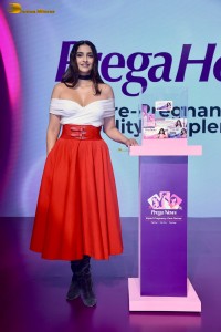 sonam kapoor hot looks in a white shoulderless top and red skirt at an event