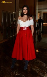 sonam kapoor hot looks in a white shoulderless top and red skirt at an event