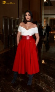 sonam kapoor hot looks in a white shoulderless top and red skirt at an event