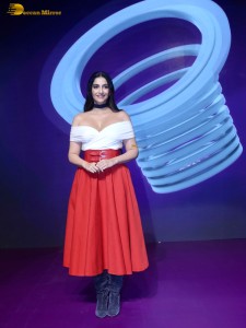 sonam kapoor hot looks in a white shoulderless top and red skirt at an event