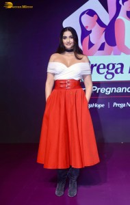 sonam kapoor hot looks in a white shoulderless top and red skirt at an event
