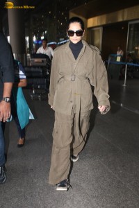 actress Sonam Kapoor stylish in a brown overcoat at airport