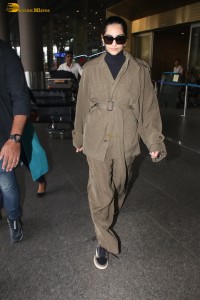 actress Sonam Kapoor stylish in a brown overcoat at airport