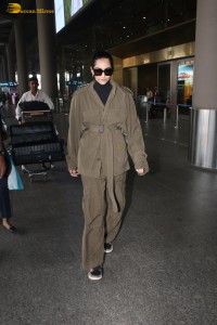 actress Sonam Kapoor stylish in a brown overcoat at airport
